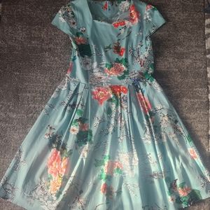 2 fit and flare retro dresses one with a cardigan.